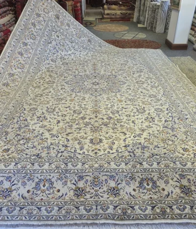 Authentic Nain rug, Size: 407 x 295 cm, Persian masterpiece featuring a traditional central medallion and intricate Shah Abbasi floral motifs, Ivory field with sky blue accents, Hand-knotted with high precision fine wool on a stable cotton foundation.