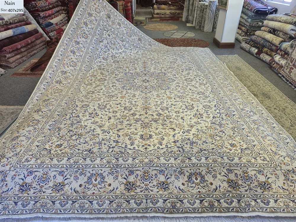 Authentic Nain rug, Size: 407 x 295 cm, Persian masterpiece featuring a traditional central medallion and intricate Shah Abbasi floral motifs, Ivory field with sky blue accents, Hand-knotted with high precision fine wool on a stable cotton foundation.