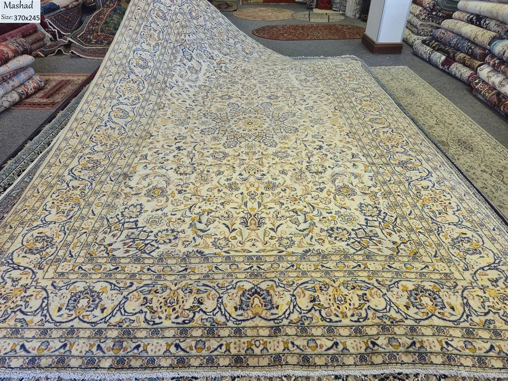 Fine handmade Mashad rug, Size: 370 x 245 cm, A rare, luminous ivory field accented by deep indigo blues and golden-ochre details. Premium wool on a sturdy cotton foundation for a soft feel and lifelong wear.
