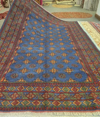 Hand-Knotted Afghan Bokhara, Size: 291 x 193 cm, in cobalt blue with a traditional "gol" (elephant's foot) pattern, High-quality wool on a durable cotton foundation.