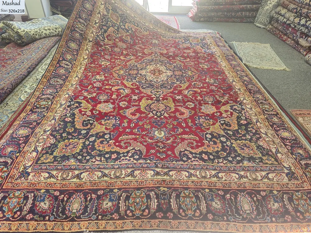 Hand-Knotted Antique Mashad is a Pre-loved Persian carpet, Size: 326 x 218 cm, 100% natural wool pile on a sturdy cotton foundation.