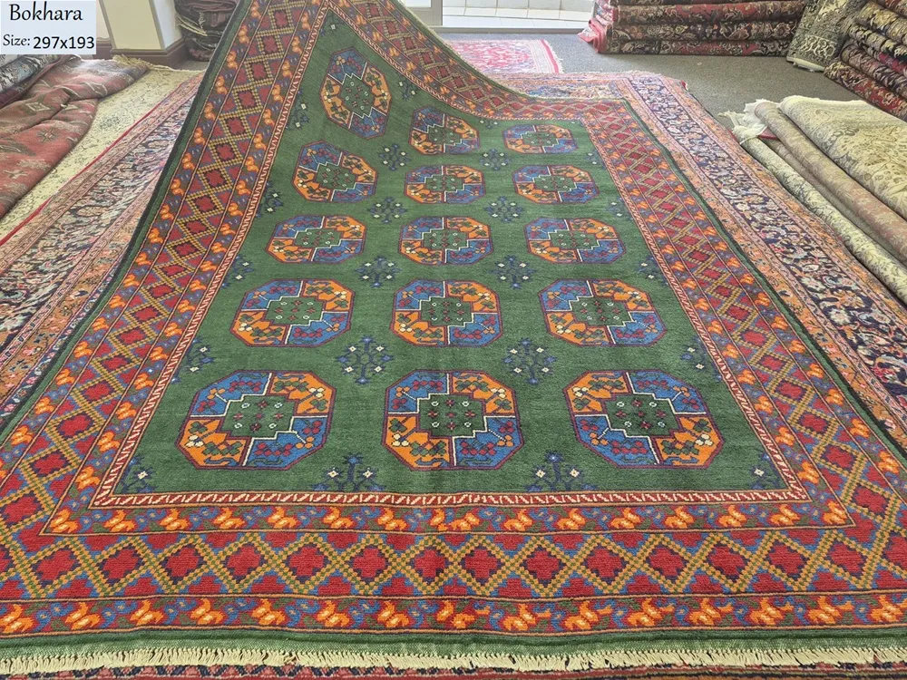 Hand-Knotted Afghan Bokhara rug, Size: 297 x 193cm, A rare and lush Emerald Green, Tekke Gül (Elephant Foot) octagonal motif, Crafted from premium wool with a lustrous finish.