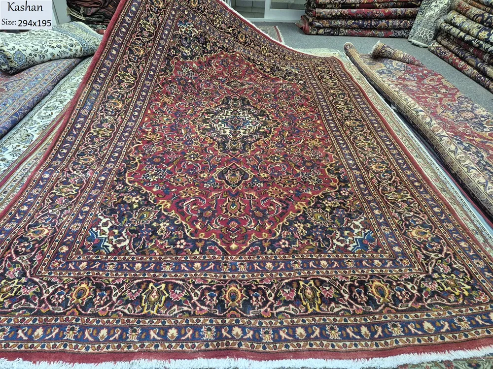 Handmade Kashan rug, Size: 294 x 195 cm, Traditional Central Medallion with intricate floral motifs, Crimson Red, Navy Blue, high-quality wool on a cotton foundation.