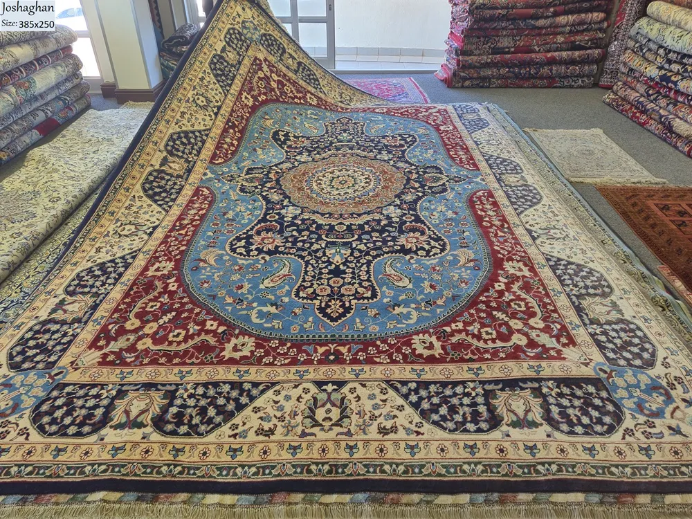 Pre-Loved fine handmade Joshaghan Persian carpet, Size: 385 x 251 cm, Medallion with floral arabesque and weeping willow motifs, Royal Blue, Crimson Red, Navy, and Ivory.