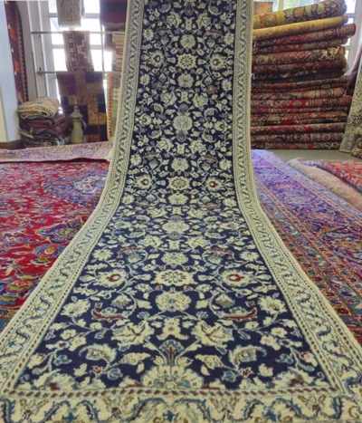 Pre-loved Hand-knotted Persian Nain runner, Size: 292 x 80 cm, deep navy field paired with the ivory floral motifs, hand-spun wool with fine silk.
