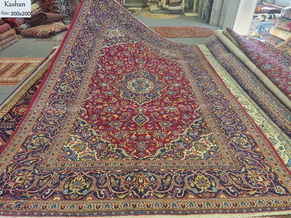 Pre-loved Hand-knotted Persian Kashan rug, Size: 300 x 200 cm, natural wool & vegetable dye, R12 000 valuation certificate.