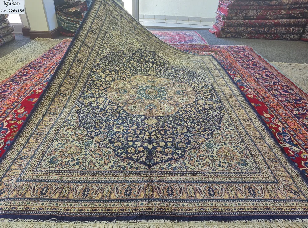 Second hand Persian Isfahan rug, Size: 226 x 156 cm, Royal blue floral design.