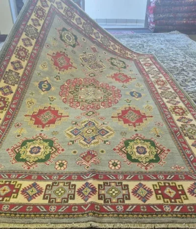 Afghan handmade Qazaq rug, Size: 238 x 148 cm, fine knotted by natural wool & vegetable dye. R18 000 valuation certificate.