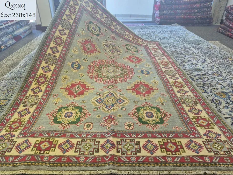 Afghan handmade Qazaq rug, Size: 238 x 148 cm, fine knotted by natural wool & vegetable dye. R18 000 valuation certificate.