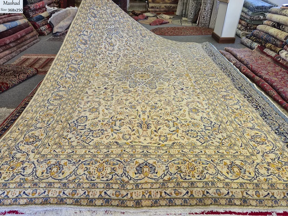 Authentic Mashad Hand-Knotted Persian Rug, Size: 368 x 250 cm, luminous cream field with a grand central medallion and intricate "islimi" (arabesque) floral vine work. High-quality, soft wool pile on a sturdy cotton foundation.