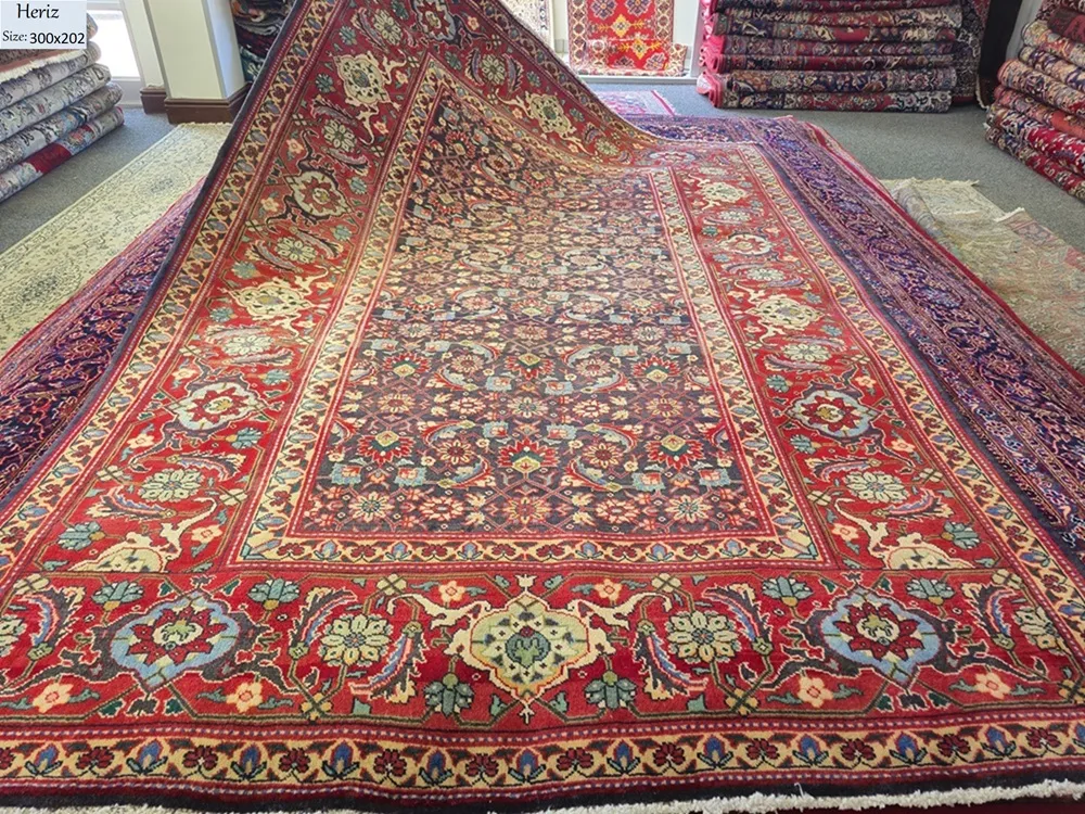 Heriz Hand-Knotted Persian Rug, Size: 300 x 202 cm, Heriz carpets are celebrated for their exceptional durability and bold, geometric character. This specific piece features a vibrant all-over botanical pattern,