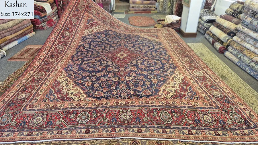Navy Kashan rug, Size: 374 x 271 cm, Hand knotted by natural wool & vegetable dye, R30 000 valuation.
