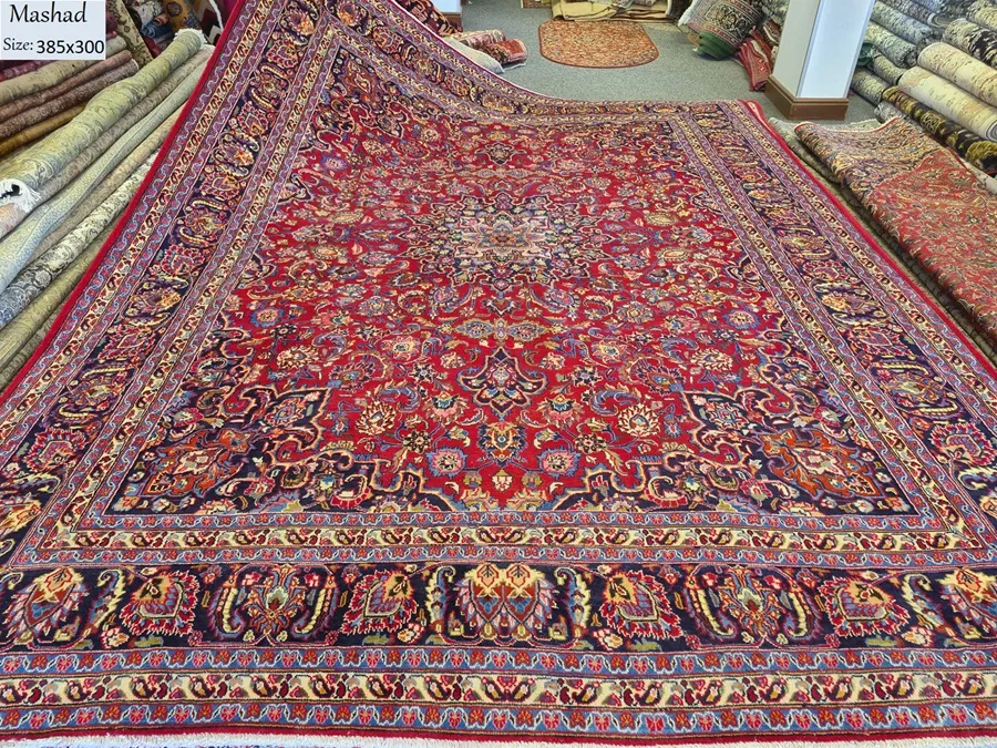 Persian Mashad carpet, Size: 385 x 300 cm, hand knotted by natural wool & vegetable dye. R15 000 valuation certificate.
