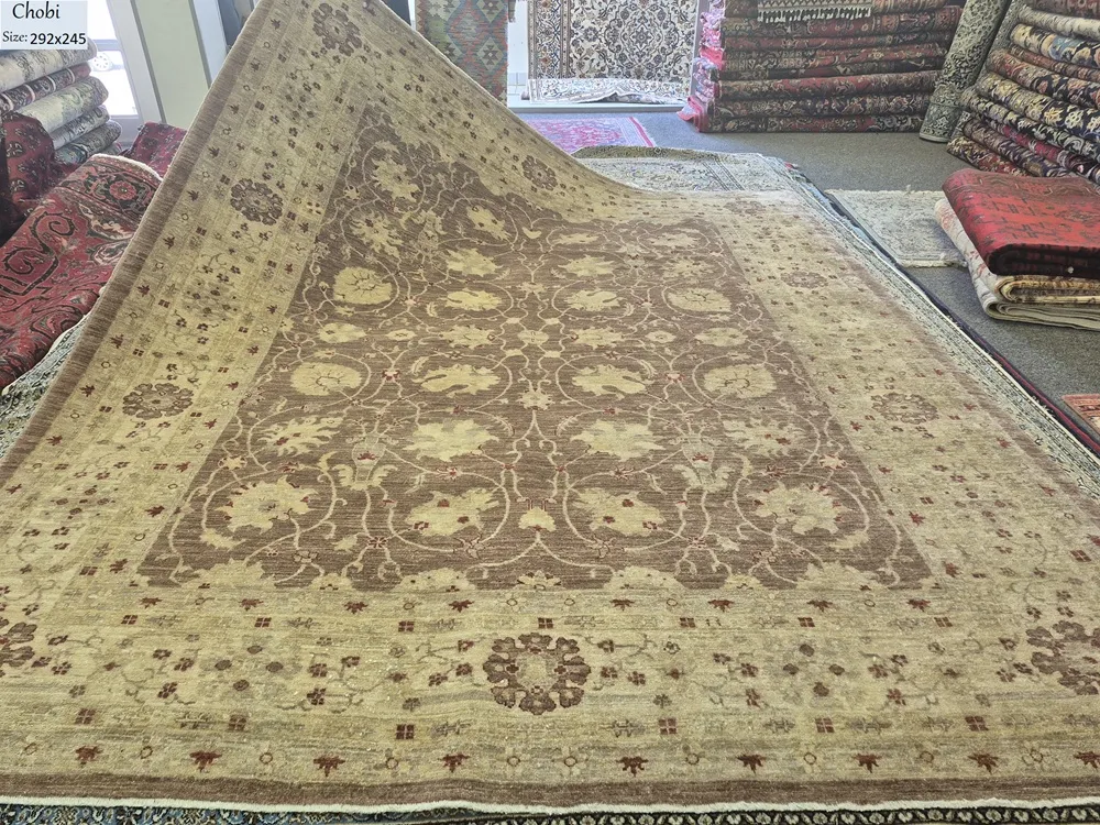pre-loved Chobi rug, Size: 292 x 245 cm, classic all-over floral palmette design in sophisticated earthy tones. Hand-knotted with high-quality hand-spun wool.