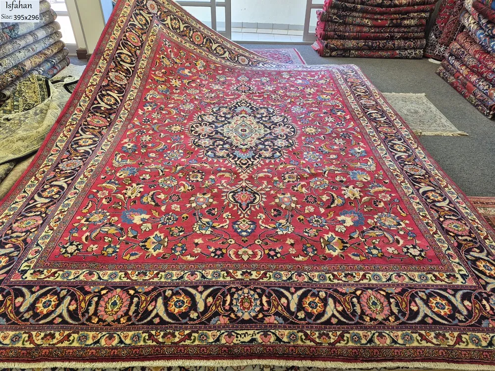 Pre loved antique Isfahan carpet, Size: 395 × 296 cm, hand knotted artist signature by natural wool & vegetable dye, R18 000 valuation certificate.