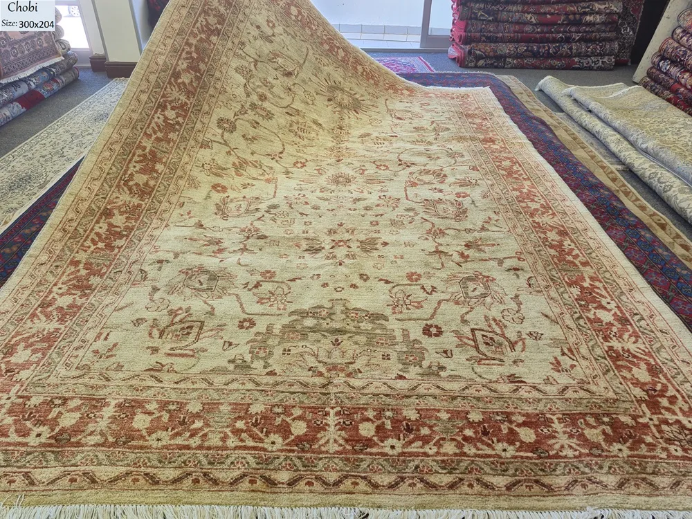 Elegant Premium Chobi rug, Size: 300 x 204 cm, muted cream base and delicate floral patterns. Very fine hand-knotted with traditional techniques.