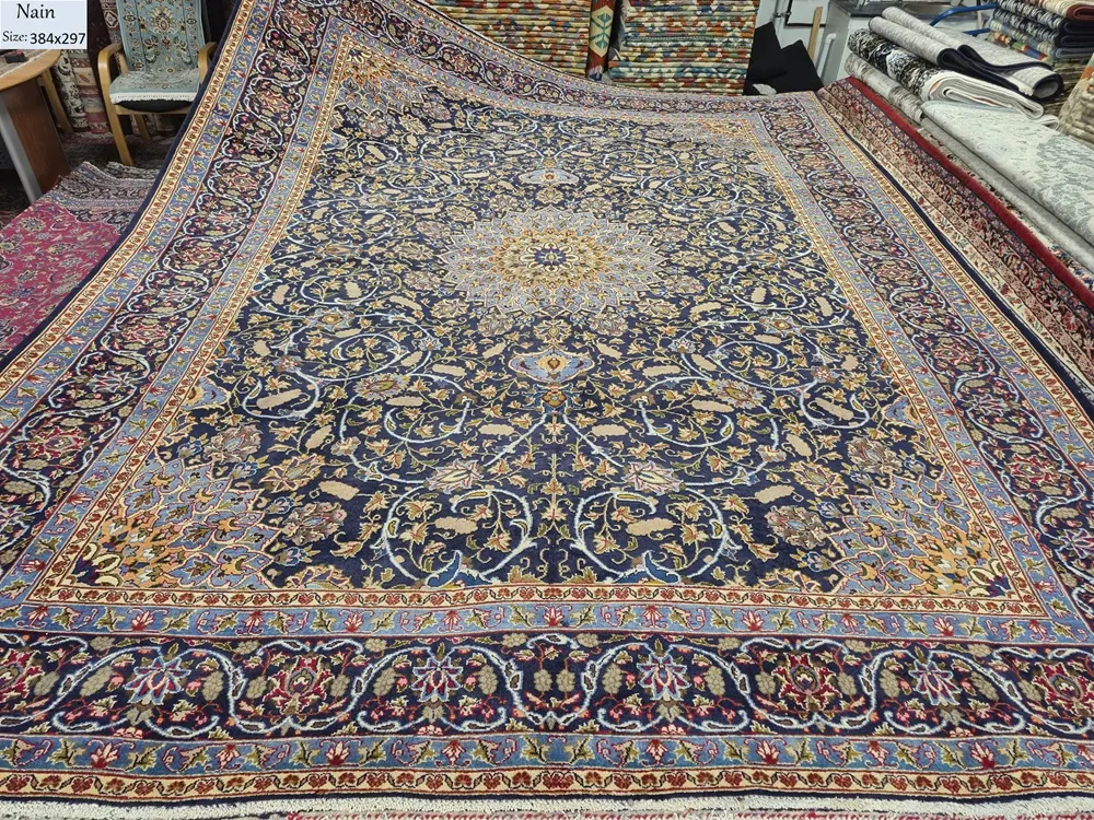 Premium Hand-Knotted Nain Persian Rug, Size: 384 x 297 cm, magnificent ivory sunburst central medallion surrounded by a complex network of interlacing islimi (arabesque) vines and floral blossoms.High-grade wool on a fine cotton foundation.