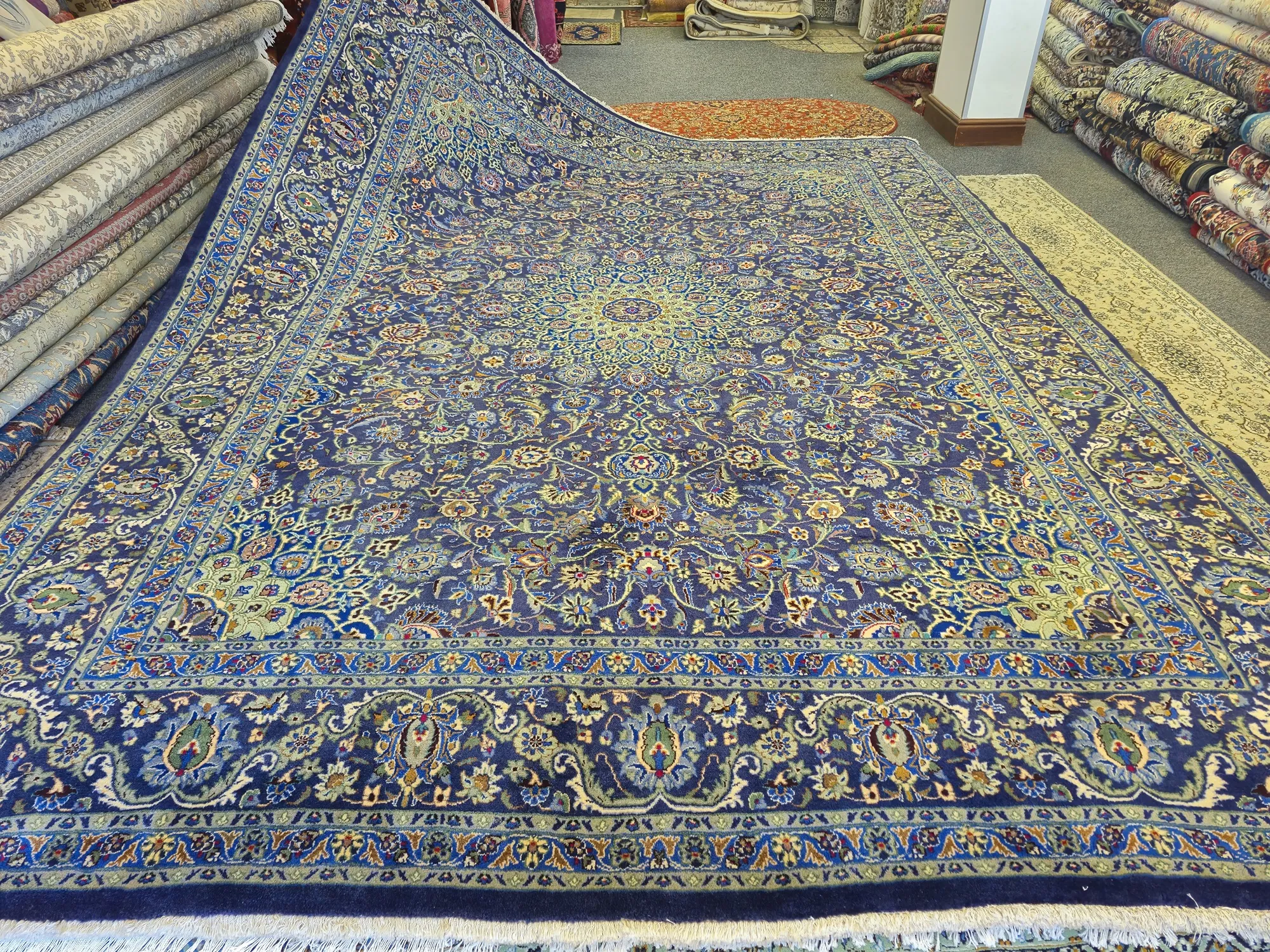 Experience the pinnacle of Persian artistry with this Hand-Knotted Nain Blue Medallion Rug. Size: 395x290 cm, fine knotted by natural wool. R50 000 valuation certificate.