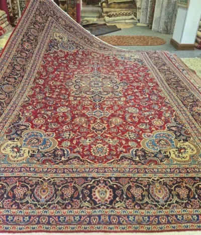 Antique hand-knotted Mashhad Persian carpet, Size: 395 x 272 cm, Lachak Toranj design, Artist signature on the carpet, craftsmanship of Khorasan weaving,excellent condition.