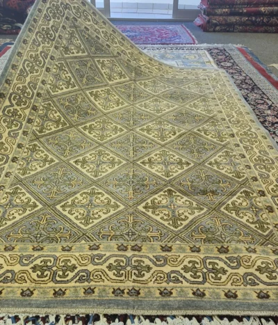 Bakhtiari Kheshti rug, Size: 229 x 171 cm, Fine hand-knotted diamond-shaped repeating geometric arabesque in muted sage greens, creams, and soft golds.