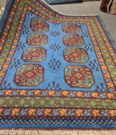Hand-Knotted sky blue Bokhara rug, Size 193 x 151 cm,, repeating octagonal Guls (Elephant’s Foot) motifs, High-quality wool pile on a cotton foundation.