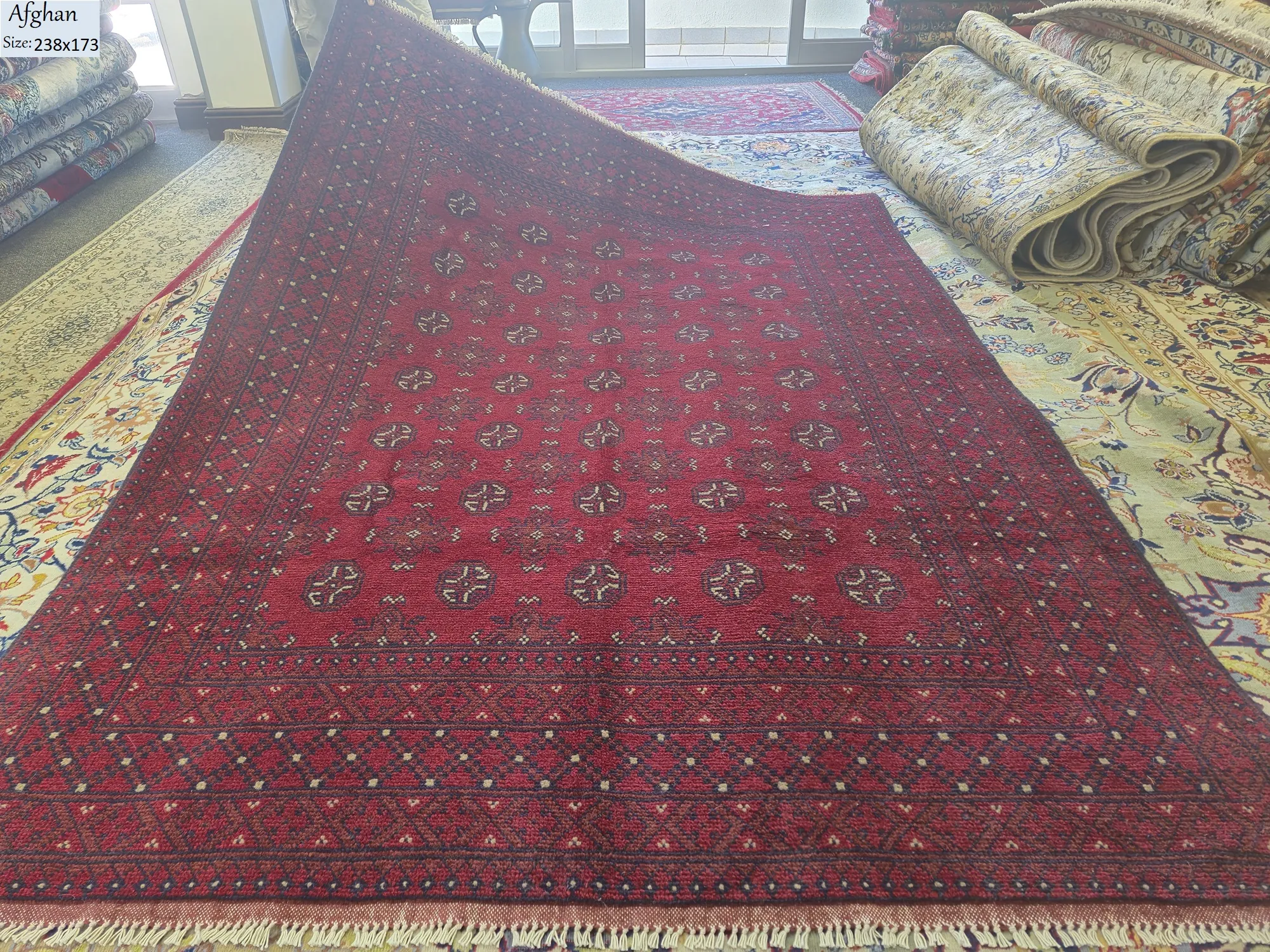 Handmade Afghan Bokhara, Size: 238 x 173 cm,  deep madder red, 100% High-quality wool pile, Primarily natural vegetable dyes.