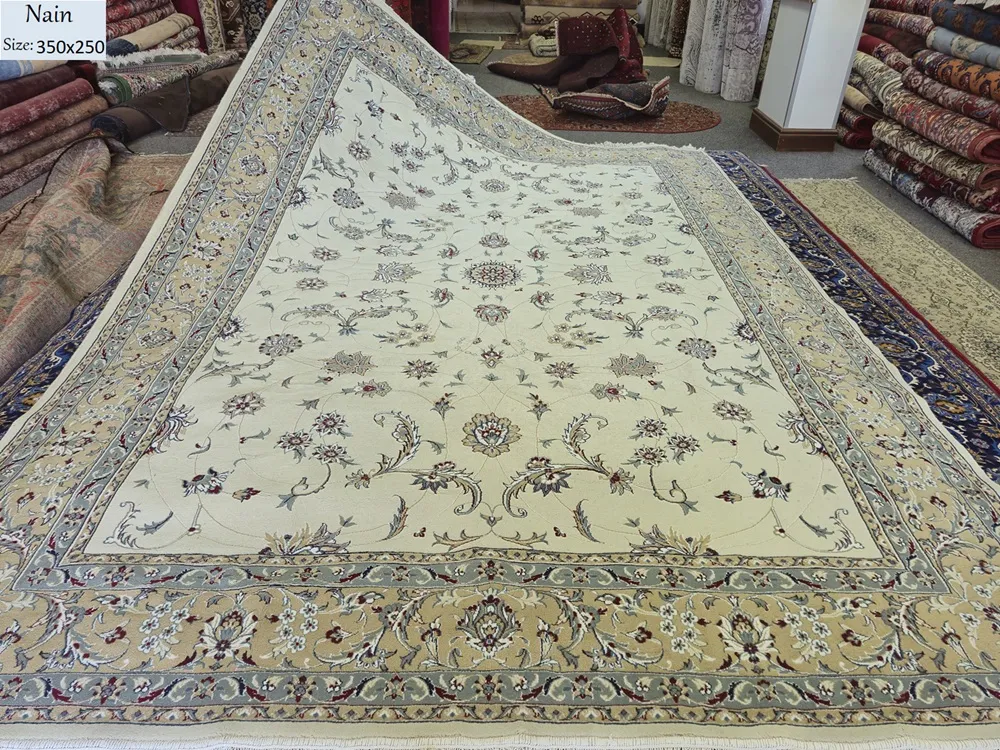 Nain carpet, Size: 350 x 250 cm, curvilinear floral patterns, ivory/cream field with soft blue, beige, 400 knots wool on cotton quality.
