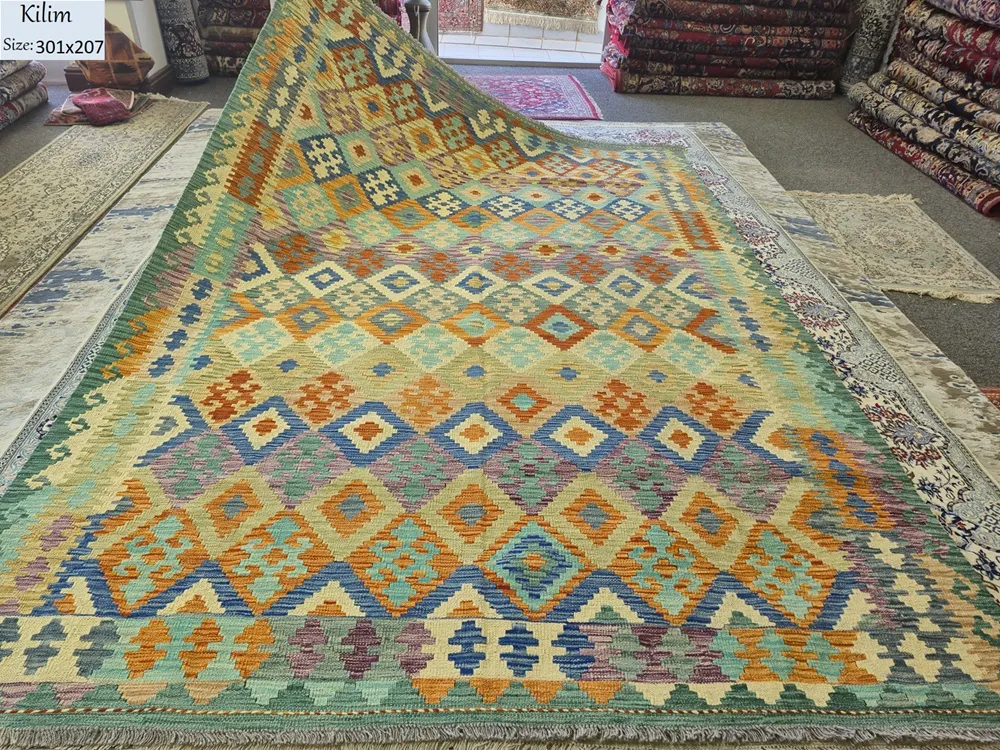 Flat-Weave Afghan Kilim, Size: 301 x 207 cm, Interlocking diamond medallions with a striking zigzag stepped border, golden mustard, terracotta orange, deep teal & bold royal blue accents 100% Hand-spun Wool on a Wool foundation.
