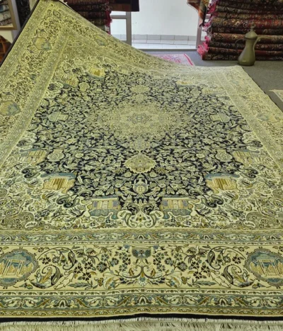 Pre-Loved Isfahan carpet, Size: 400 x 300 cm, Starburst points with scrolling vines (eslimi) & perfectly proportioned Shah Abbasi flower palmettes within indigo & soft green field.