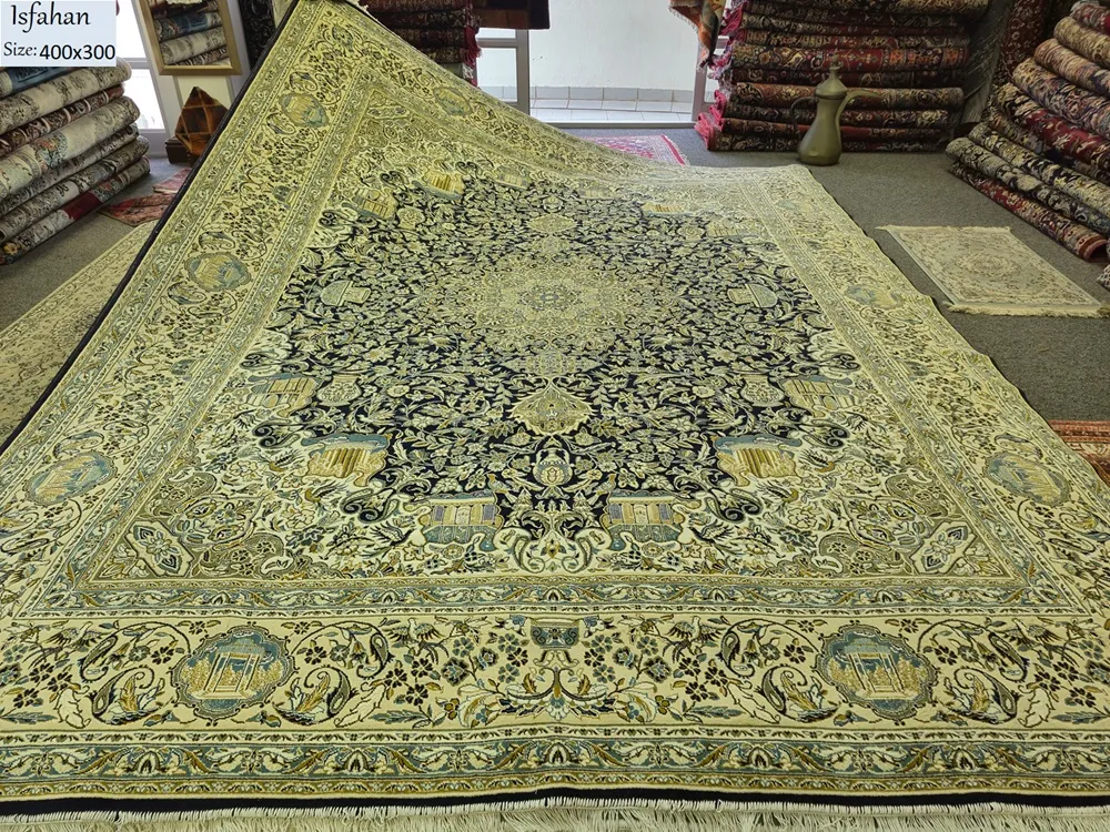 Pre-Loved Isfahan carpet, Size: 400 x 300 cm, Starburst points with scrolling vines (eslimi) & perfectly proportioned Shah Abbasi flower palmettes within indigo & soft green field.