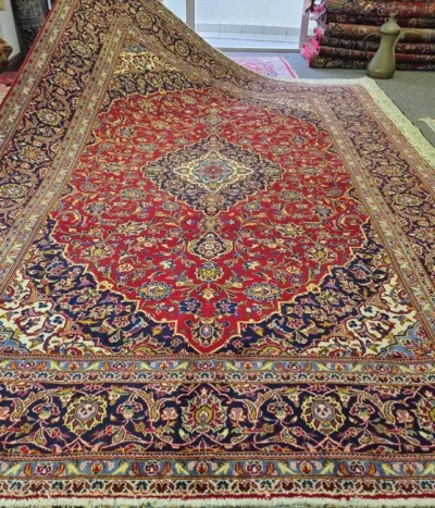 Traditional Kashan Persian Carpet, Size: 355 x 245 cm, rich crimson red, multi-layered diamond medallion scrolling vines & delicate blossoms, Fine wool on cotton foundation.