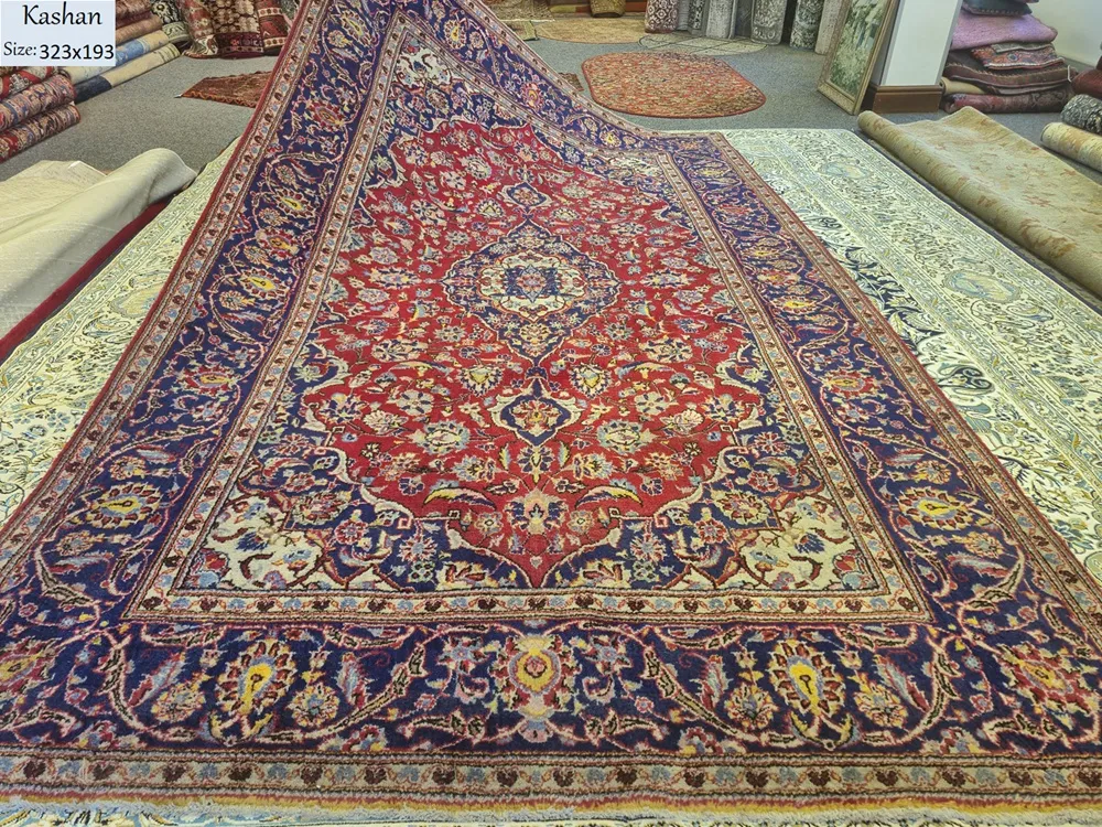 Pre-loved Hand-knotted Persian Kashan rug, Size: 323 x 193 cm, natural wool & vegetable dye, R14 000 valuation certificate.