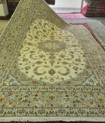 Authentic Fine Hand-Knotted Nain Persian Carpet, Size: 296 x 197 cm, elegant cream and soft ivory field adorned with intricate floral arabesques, subtle blue-gray detailing, and a classic central medallion, Fine Lamb’s Wool on a Cotton Warp.
