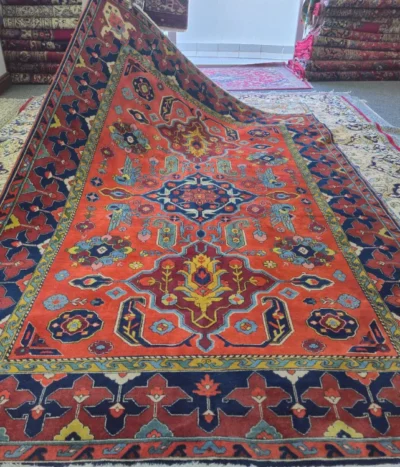 Hand-Knotted Fine Persian Heriz Carpet, Size: 300 x 200 cm, Grand geometric star medallion surrounded by stylized botanical forms and serrated leaf patterns, Rich terracotta red field, deep navy blue main border, high-grade natural wool.