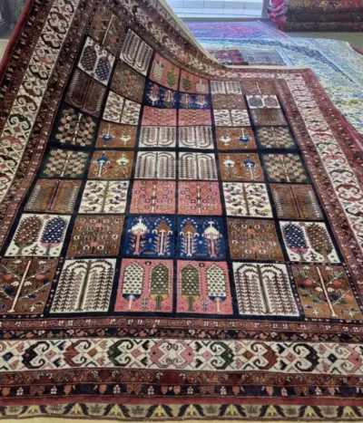 Persian handmade Bakhtiari carpet with a classic "Kheshti" design, Size: 232 x 186 cm, Burgundy, navy, terracotta & earthy tones, vey fine hand knotted silk on wool.