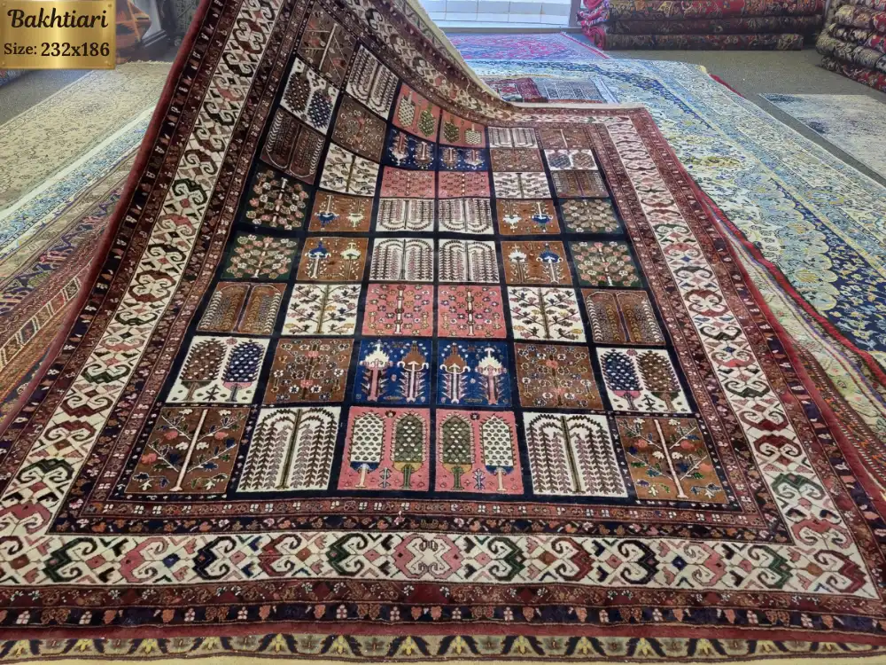 Persian handmade Bakhtiari carpet with a classic "Kheshti" design, Size: 232 x 186 cm, Burgundy, navy, terracotta & earthy tones, vey fine hand knotted silk on wool.