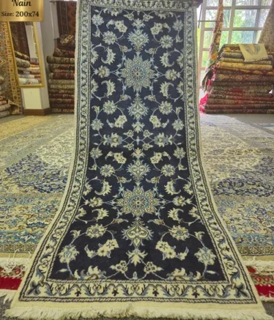Hand-knotted Persian Nain runner, Size: 200 x 74 cm, deep navy field paired with the ivory floral motifs, hand-spun wool with fine silk.