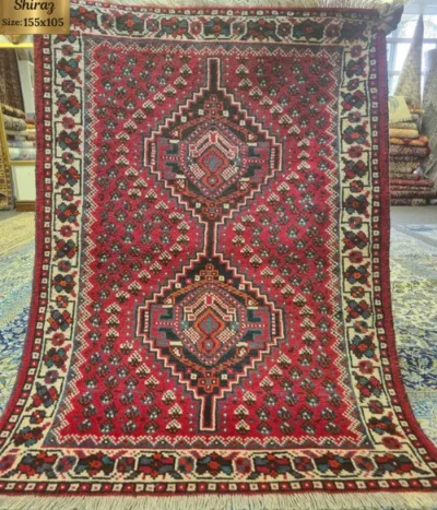 Hand-knotted Persian Shiraz rug, Size: 155 X 105 cm, classic tribal layout with two stacked, stepped diamond medallions lined with latch-hook geometric motifs, wool on wool construction.